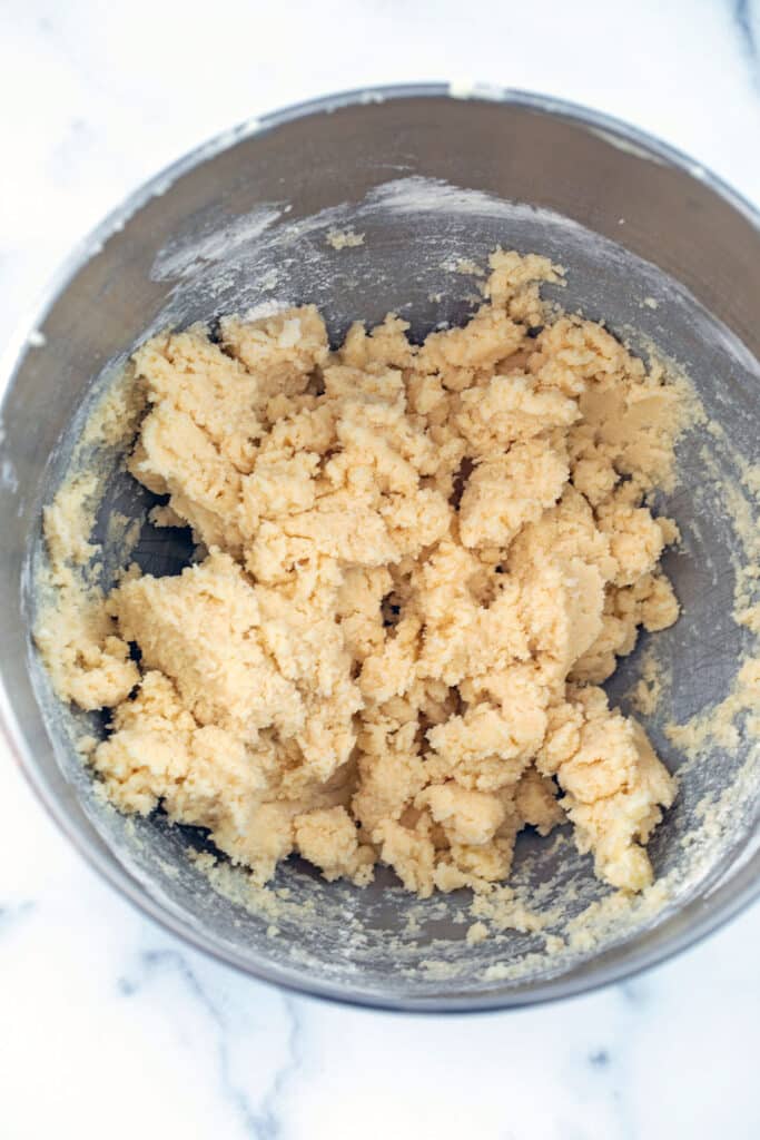 Cookie dough mixture in mixing bowl.