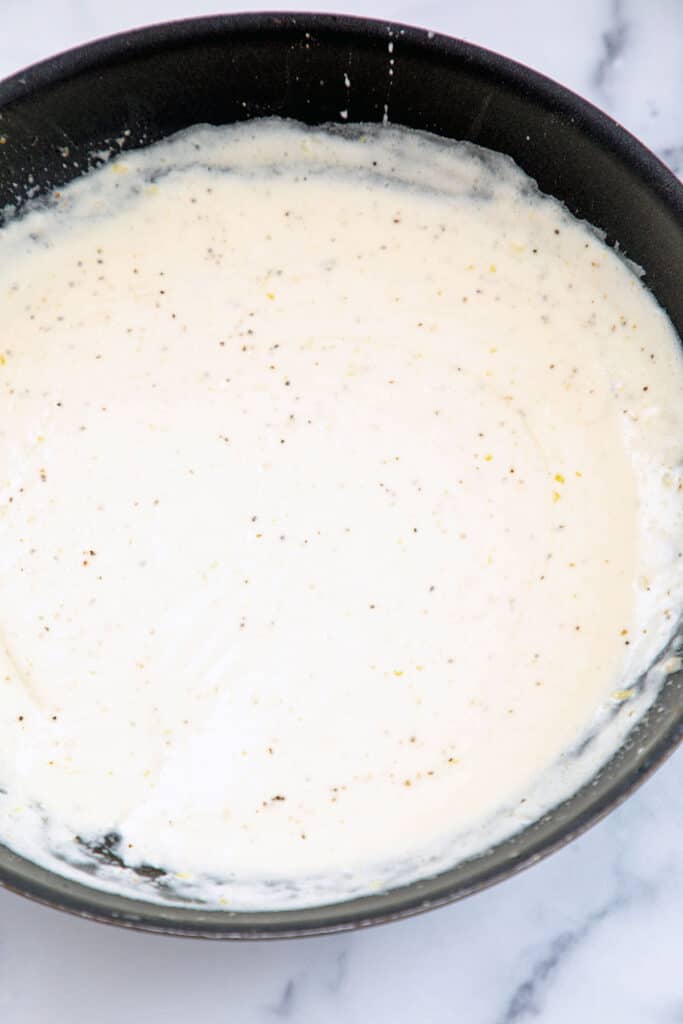Cream sauce in skillet.