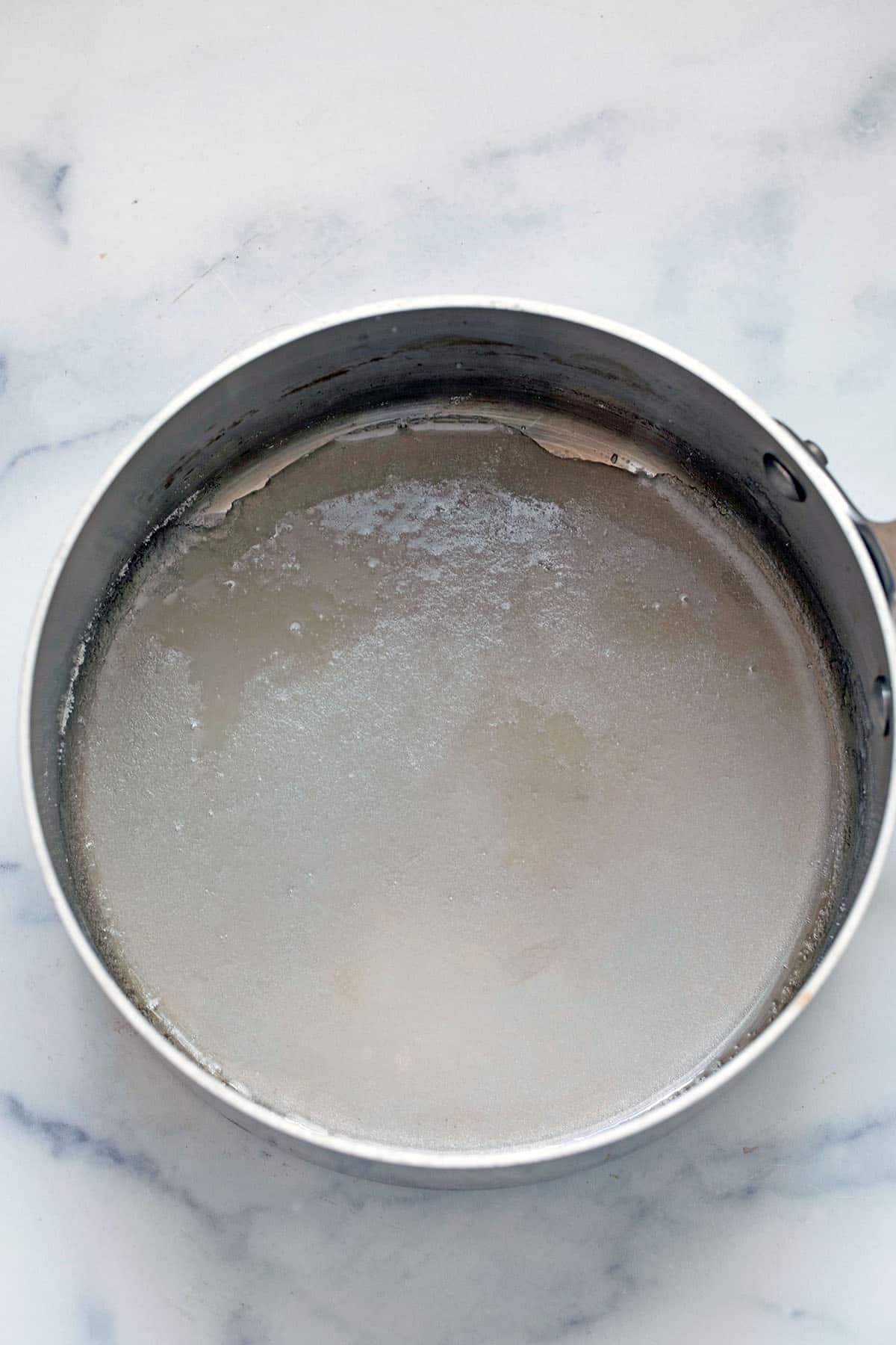 Sugar and water in saucepan.