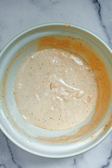 Bacon tomato dressing in a bowl.
