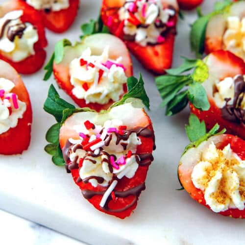 Closeup view of a deviled strawberries with melted chocolate and sprinkles.