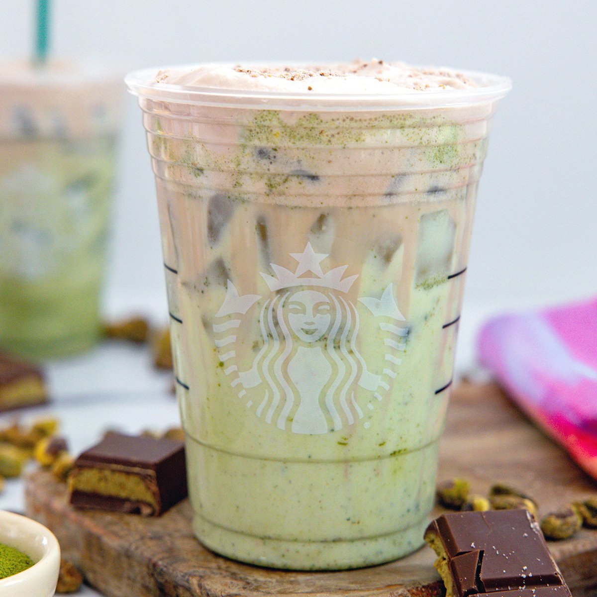 Closeup view of an Iced Dubai Chocolate Matcha in a Starbucks cup.