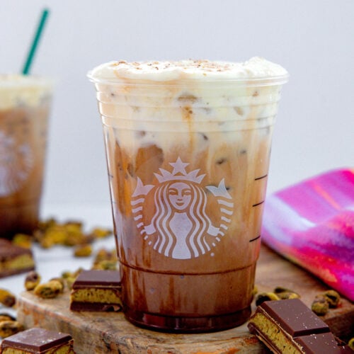 Head-on closeup view of a Dubai Chocolate Mocha in a Starbucks cup.