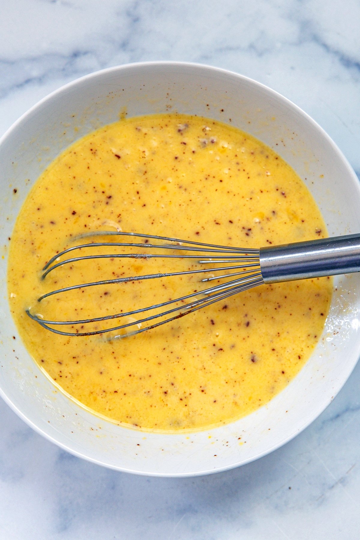 Whisk in a bowl with buttermilk and egg mixture.