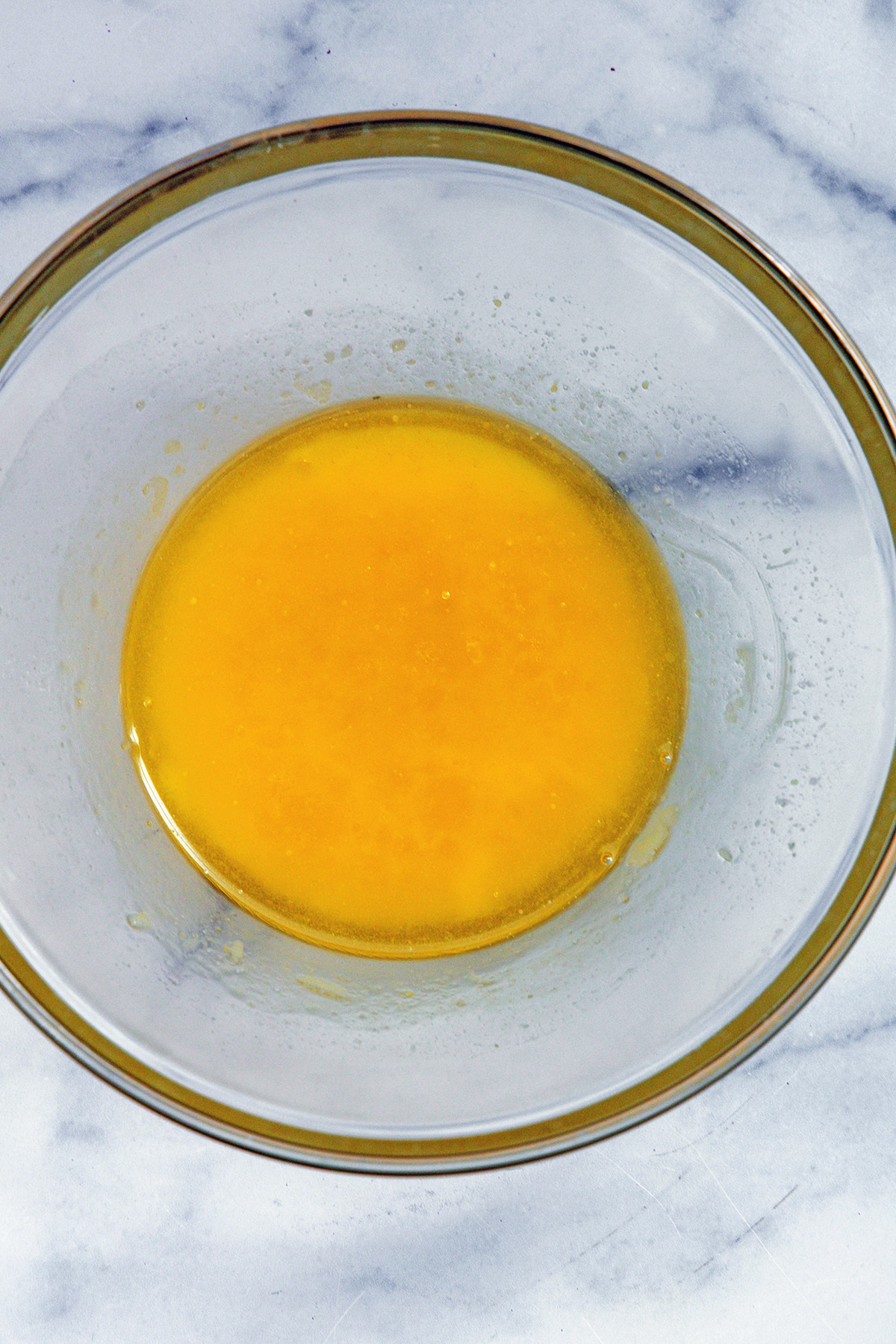 Egg and oil in mixing bowl.