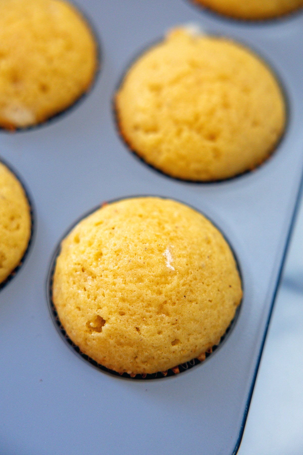 Eggnog cupcakes baked in tin.