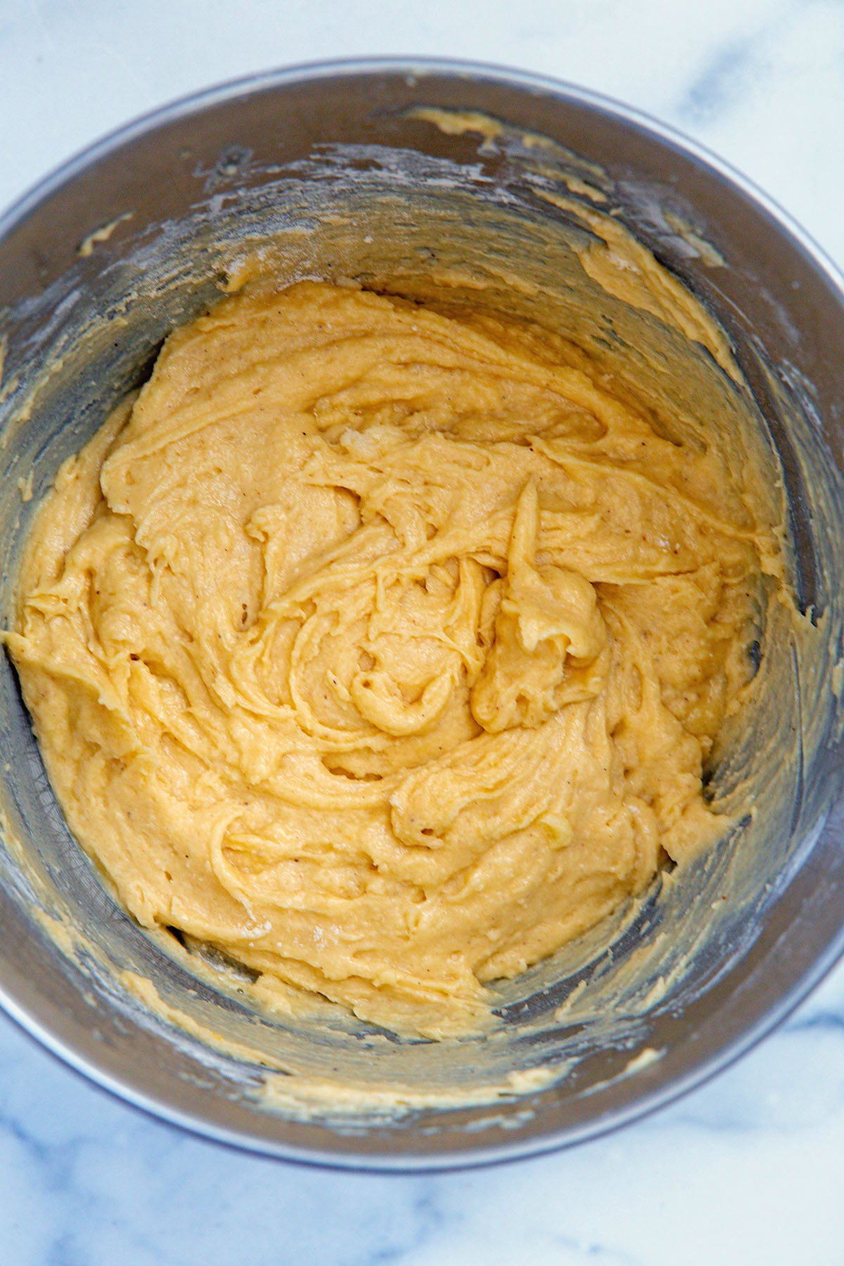 Eggnog cupcake batter in mixing bowl.
