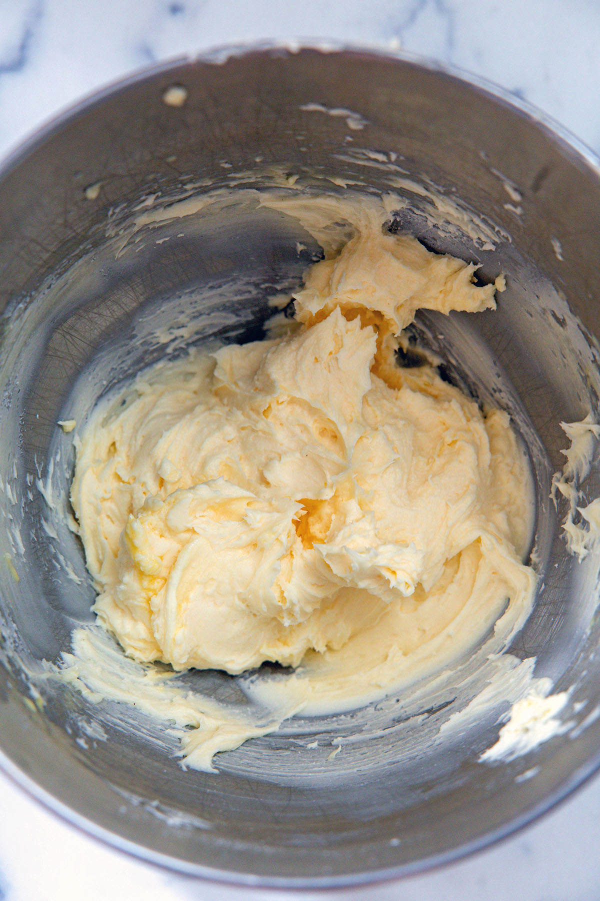 Eggnog frosting in mixing bowl.