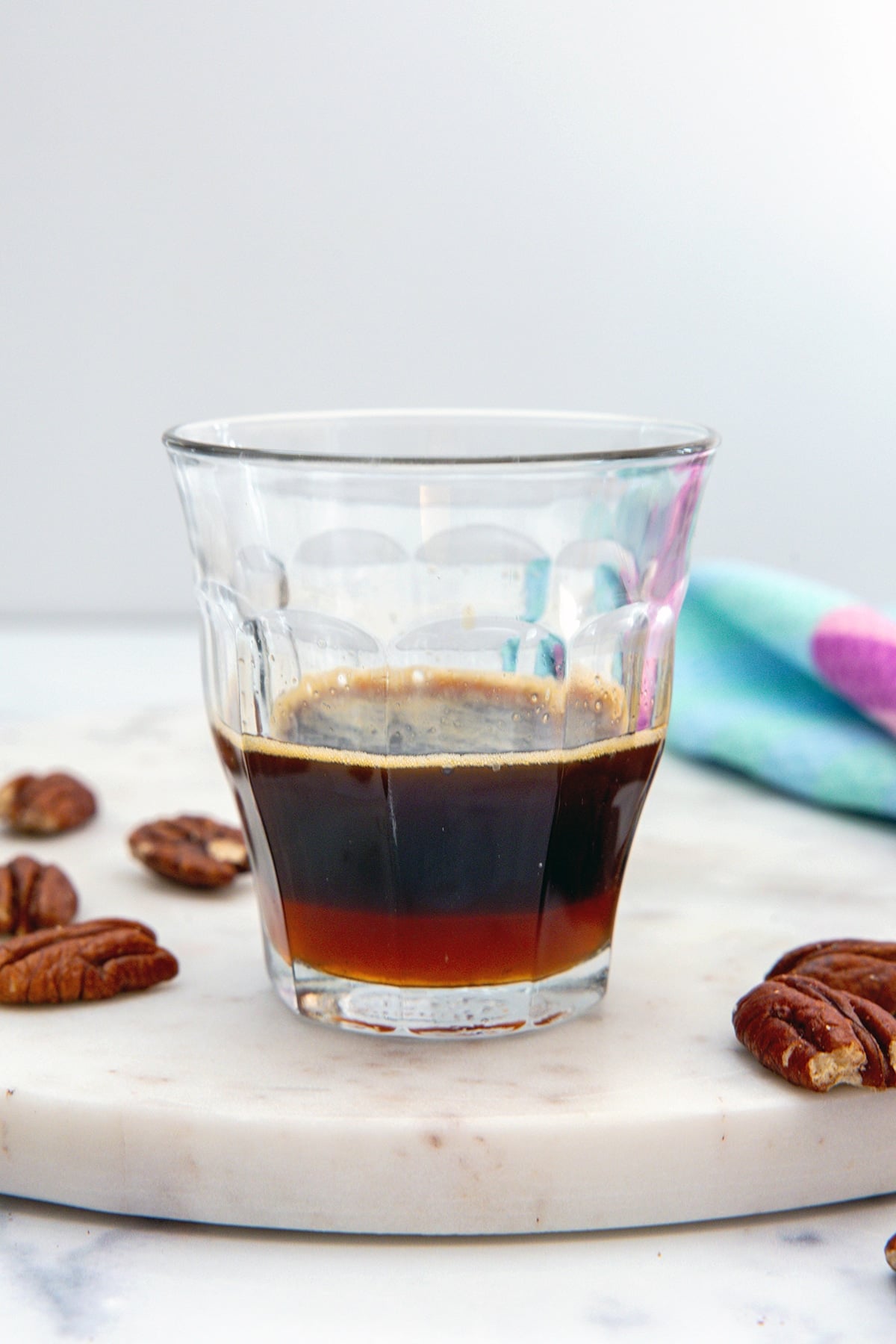 Small glass with espresso and pecan syrup.
