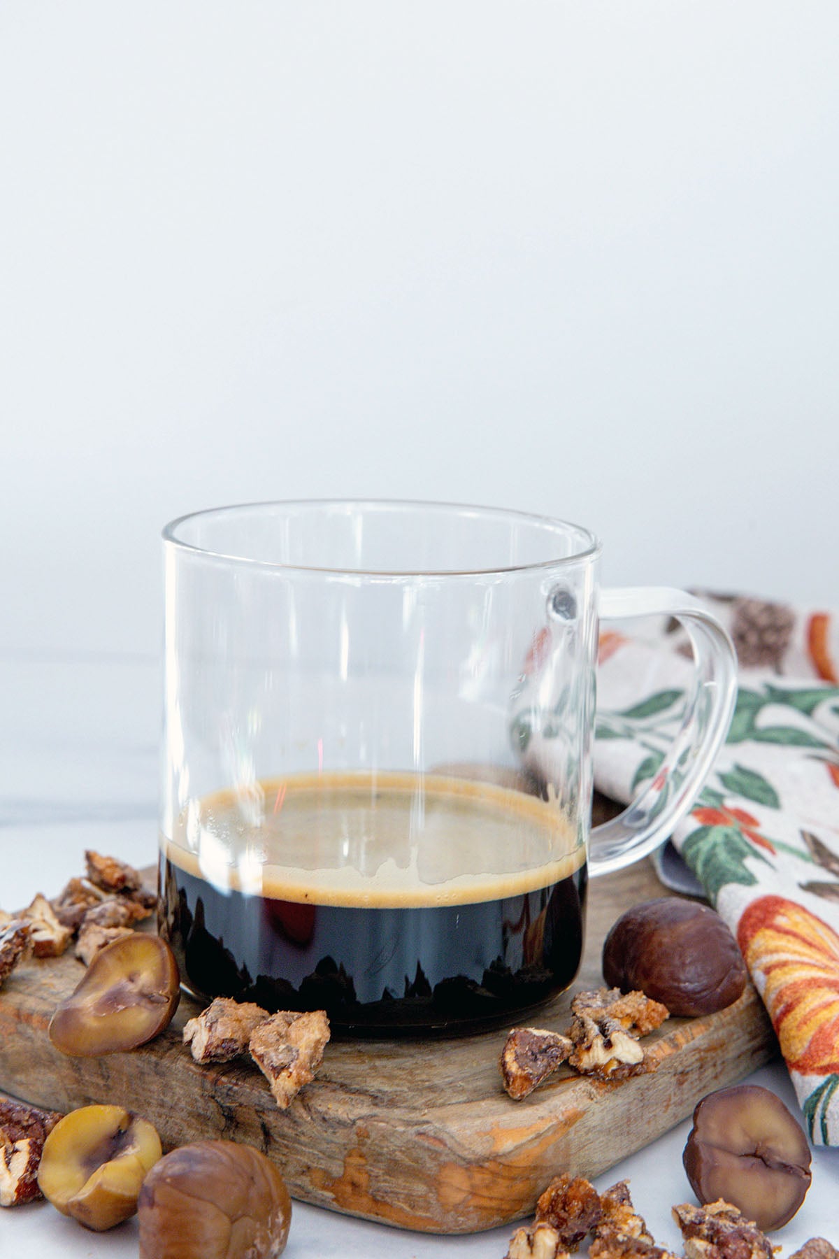 Clear mug with espresso and syrup.