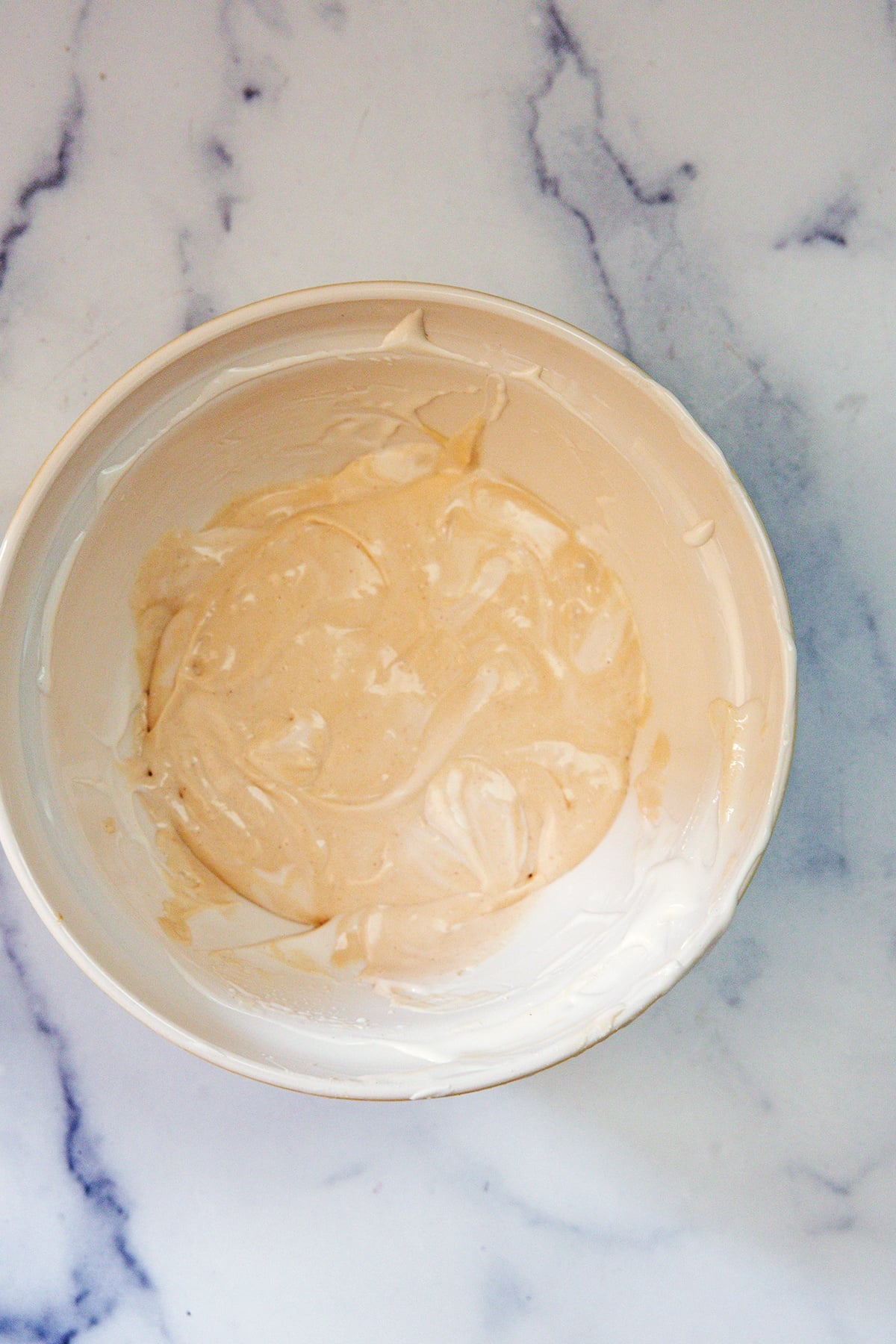 Peanut butter Frosty Paws mixture in bowl.
