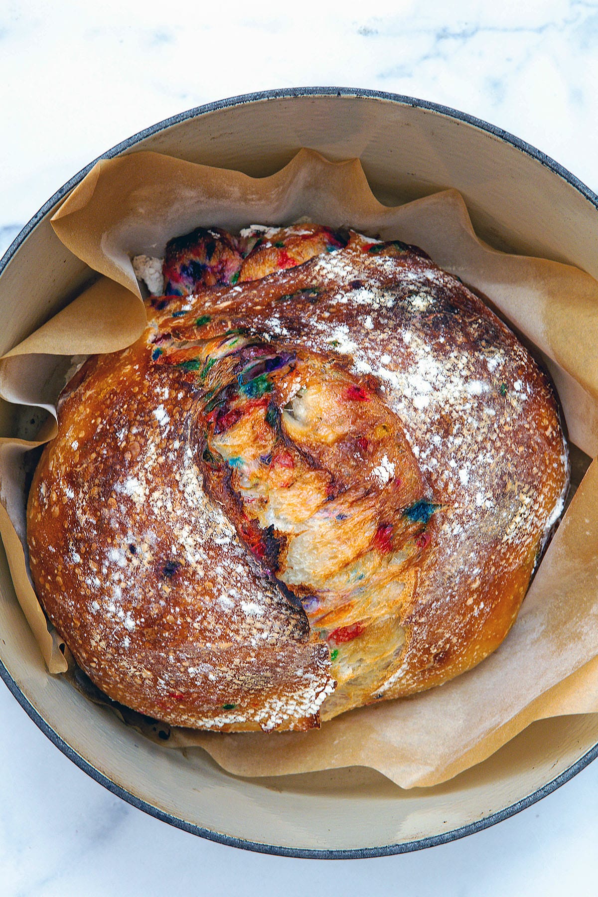 Funfetti sourdough bread baked in dutch oven just out of oven.