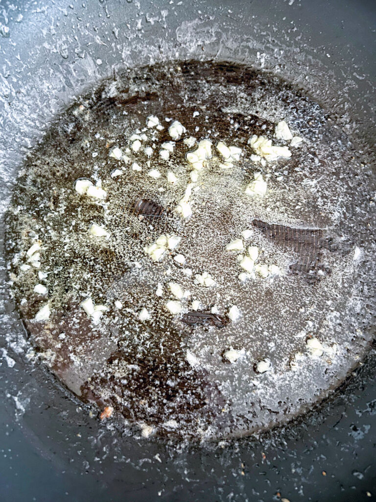 Minced garlic in butter in skillet.