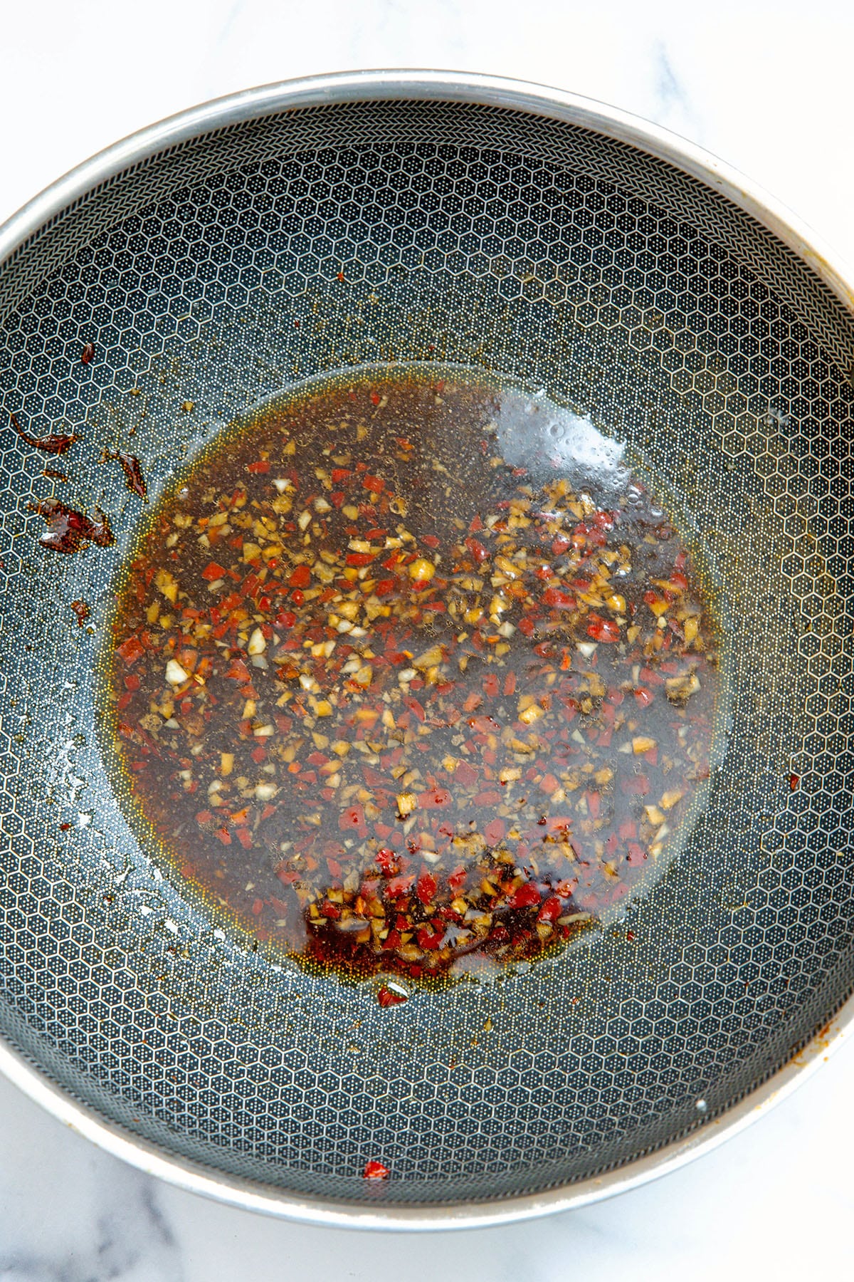 General Tso's sauce in a wok.