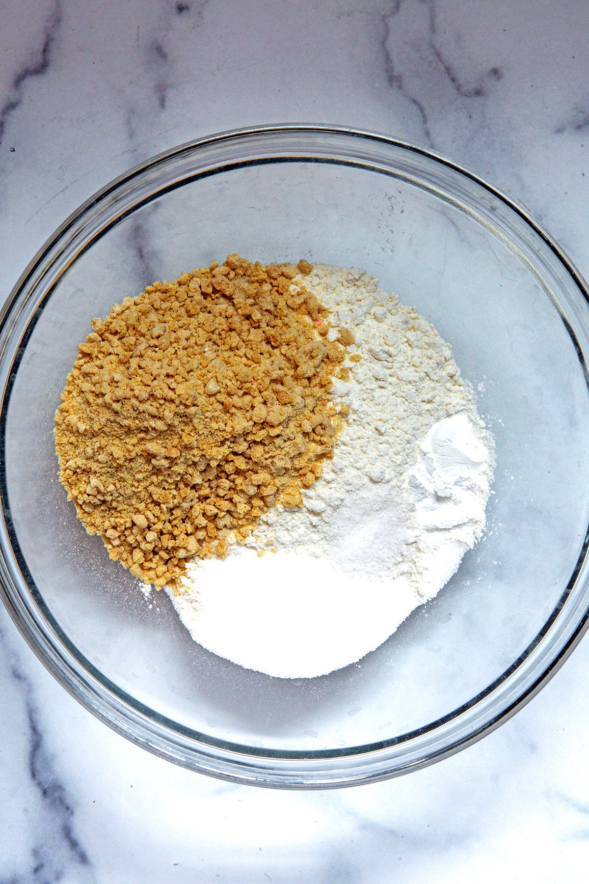 Graham crackers, flour, and sugar in mixing bowl.