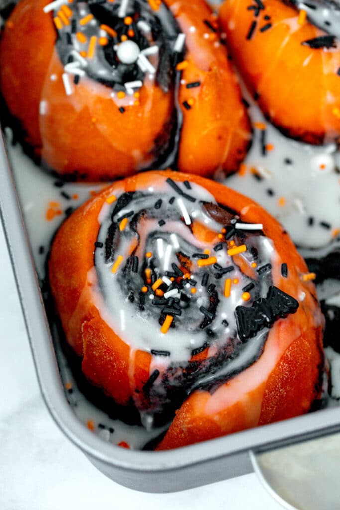 Closeup view of a Halloween cinnamon roll in the pan.