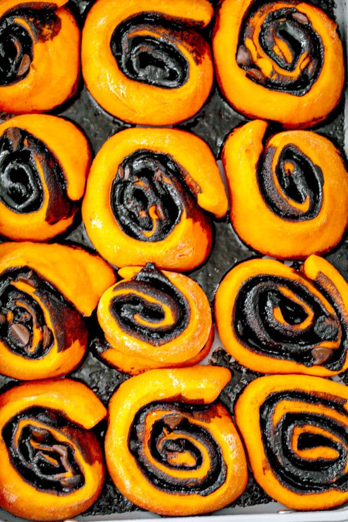 Halloween cinnamon rolls just baked in pan.