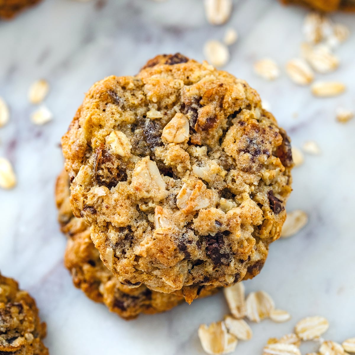 Closeup overhead view of a stack of healthy chocolate chip oatmeal cookies.