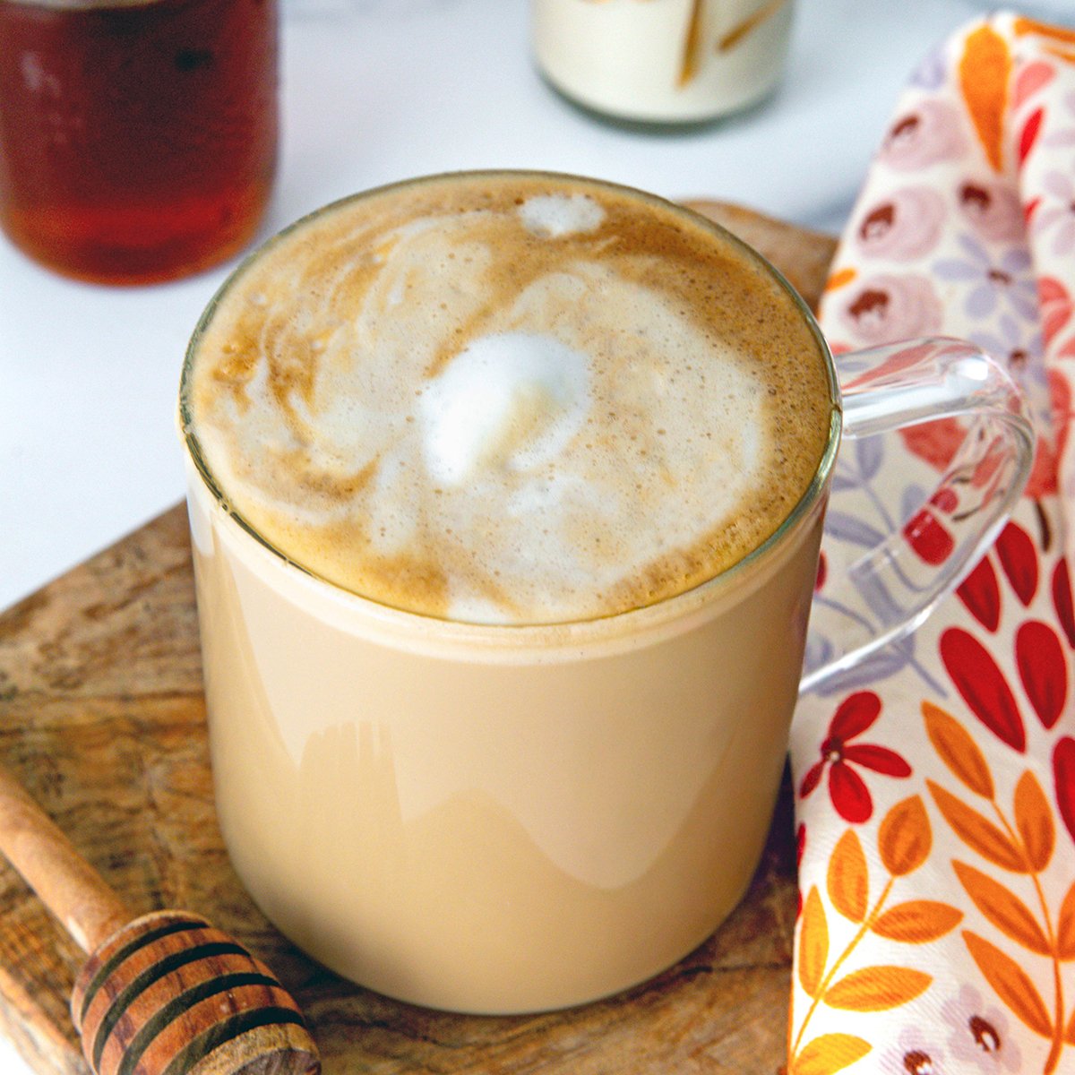 Closeup view of a Honey Almondmilk Flat White with foam.