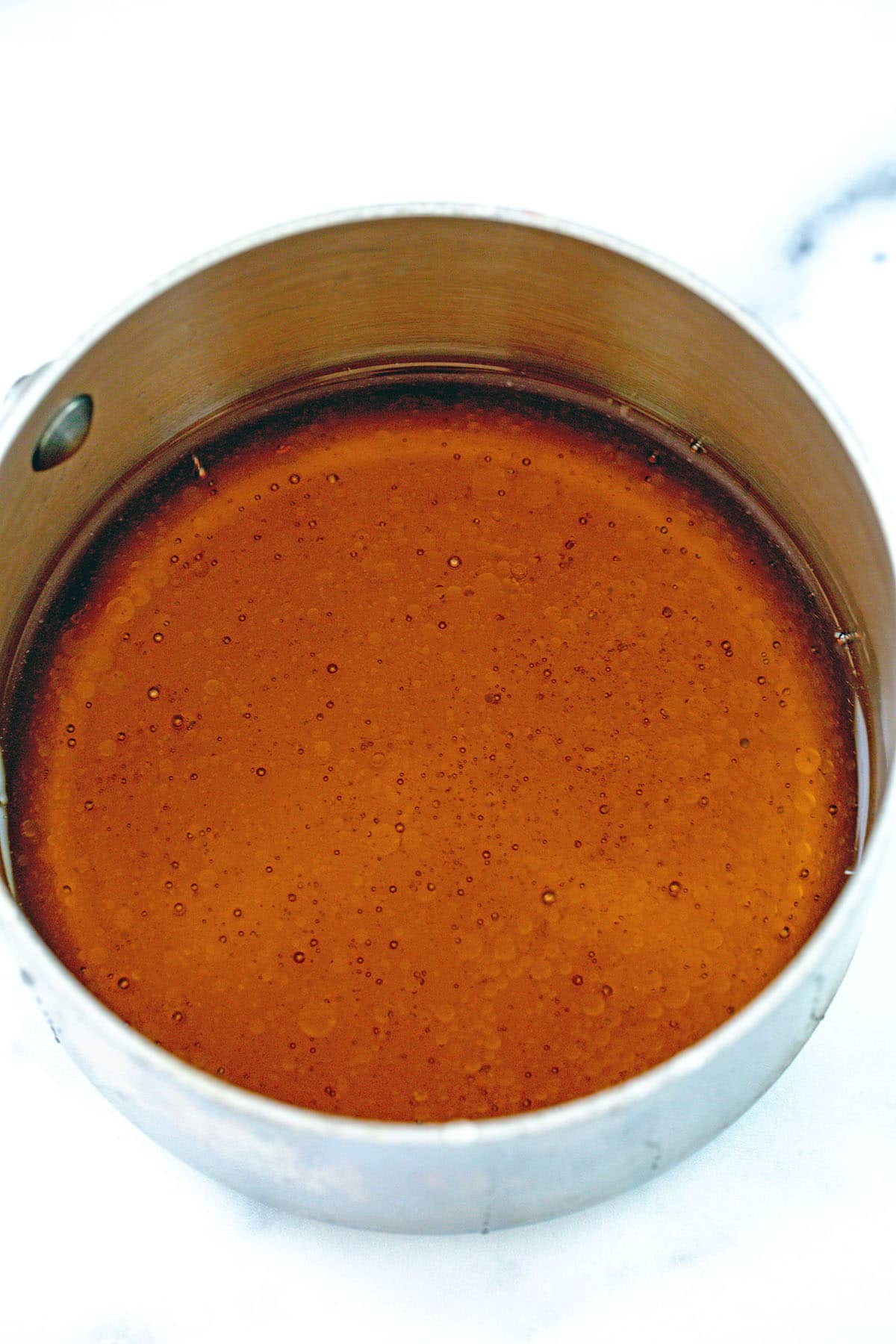 Honey simple syrup in saucepan.