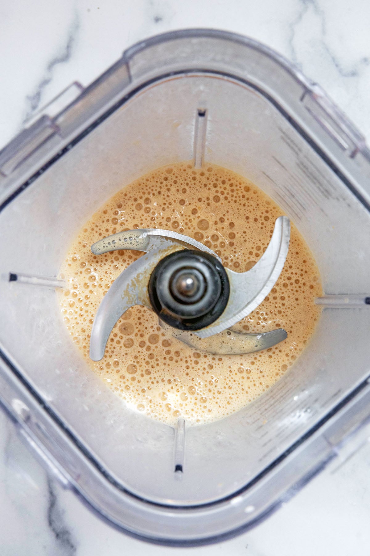Overhead view of Horchata Frappuccino blended together in blender.
