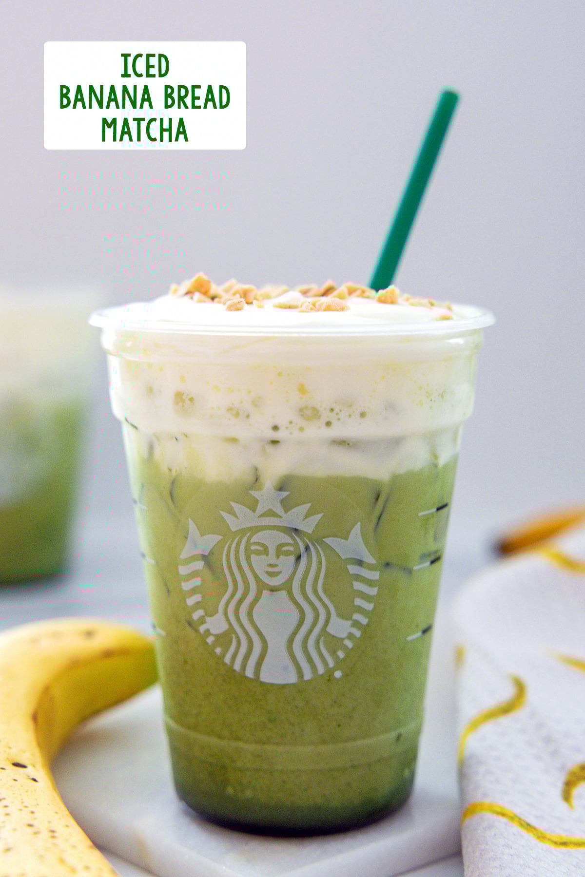 Head-on view of an Iced Banana Bread Matcha in a Starbucks cup with banana on the side and recipe title at the top.