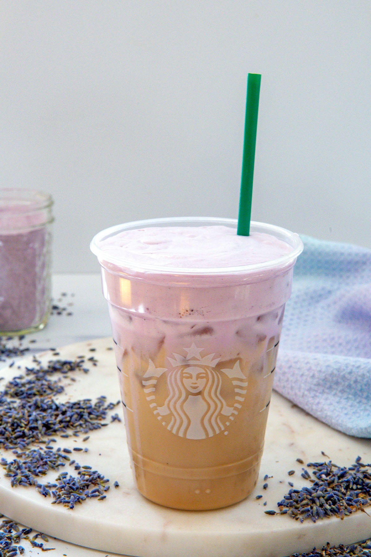 Overhead of an Iced Chai with lavender cold foam on top.