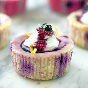 Closeup view of a lemon blueberry cheesecake cup.