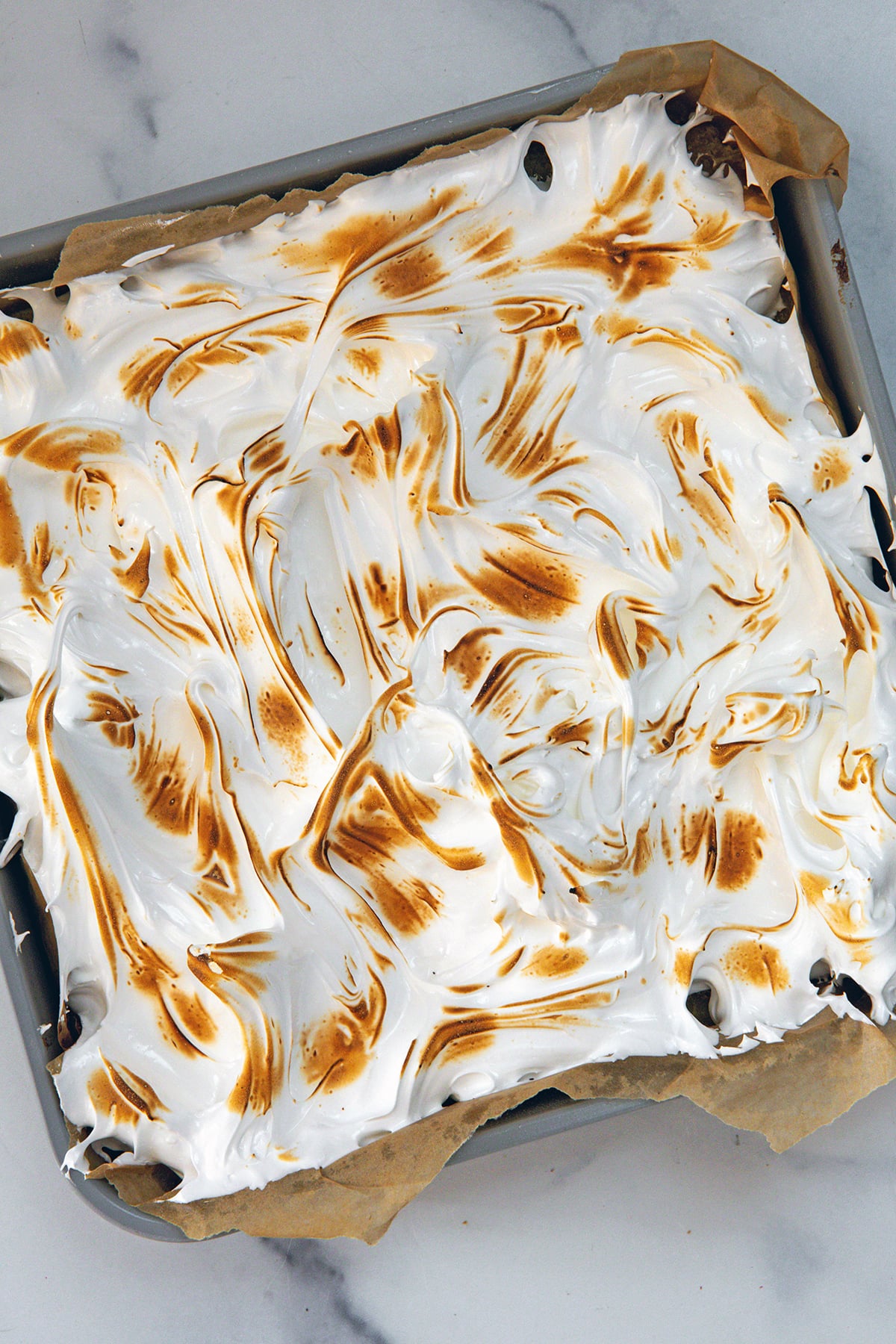 Lemon meringue bars with torched meringue topping.