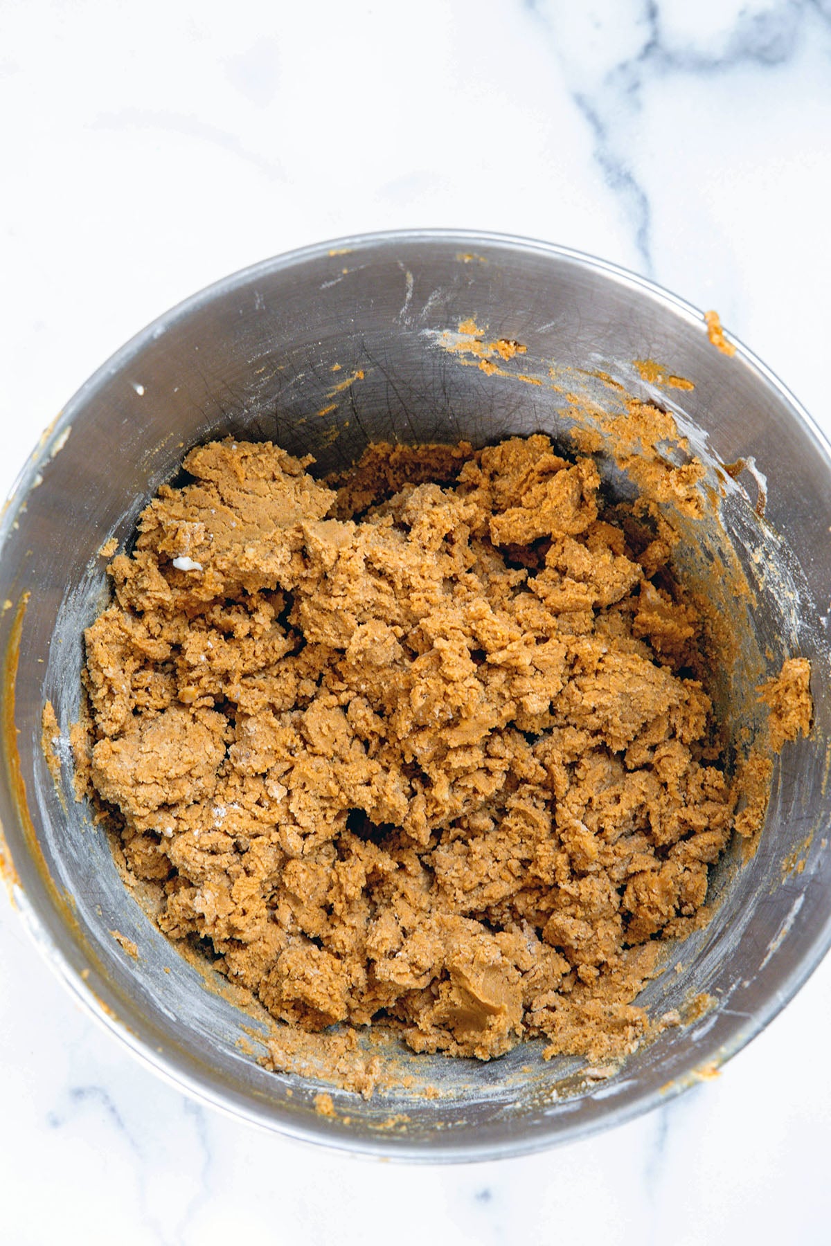 Gingerbread cookie dough in mixing bowl.