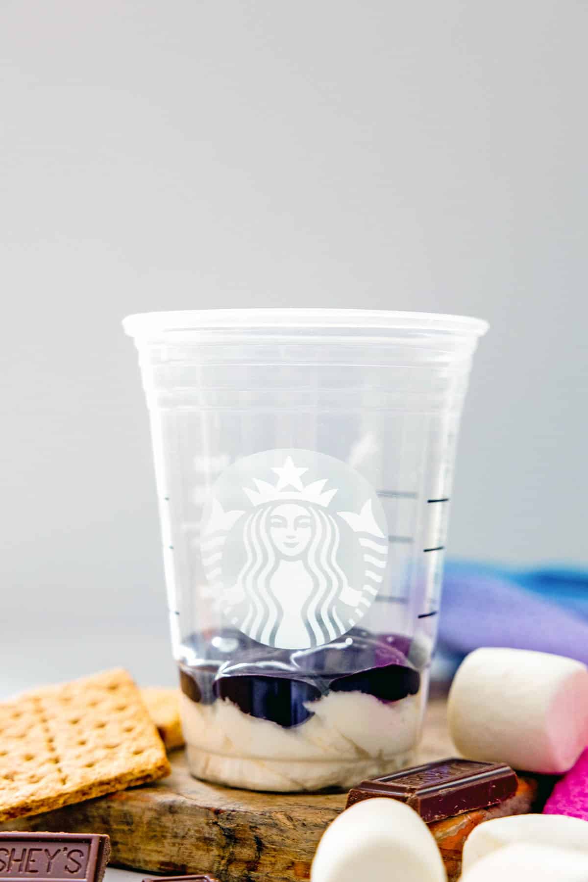 Starbucks cup with whipped cream and mocha sauce on the bottom.