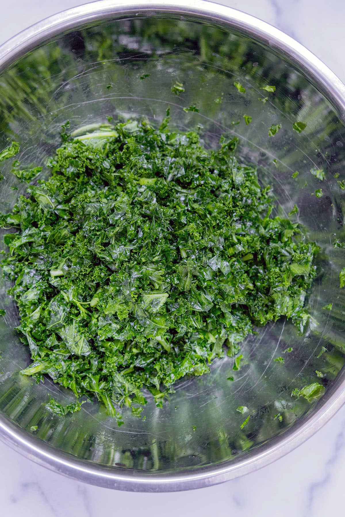 Kale massaged in bowl.