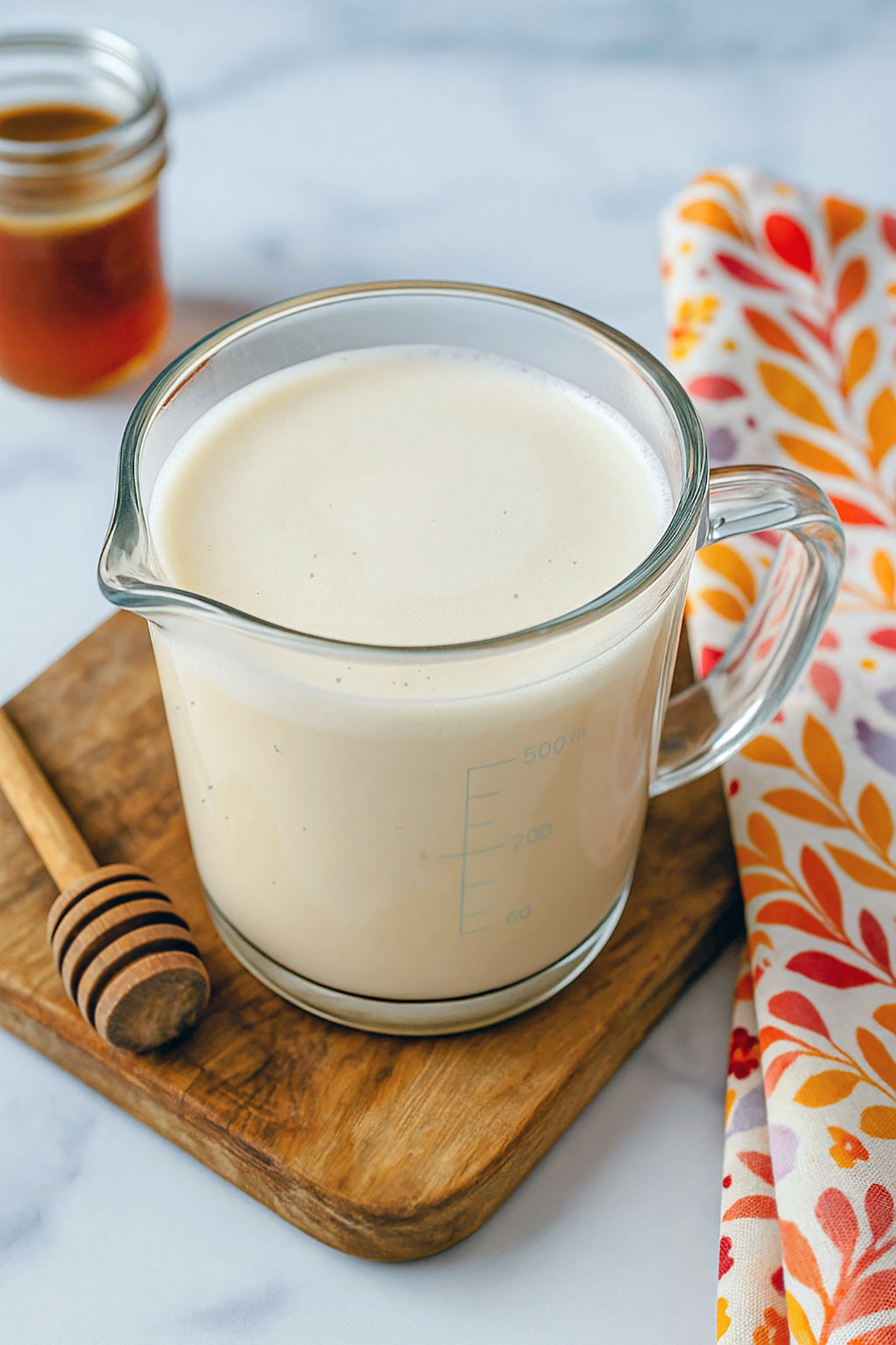 Microfoam almond milk to pour over flat white.