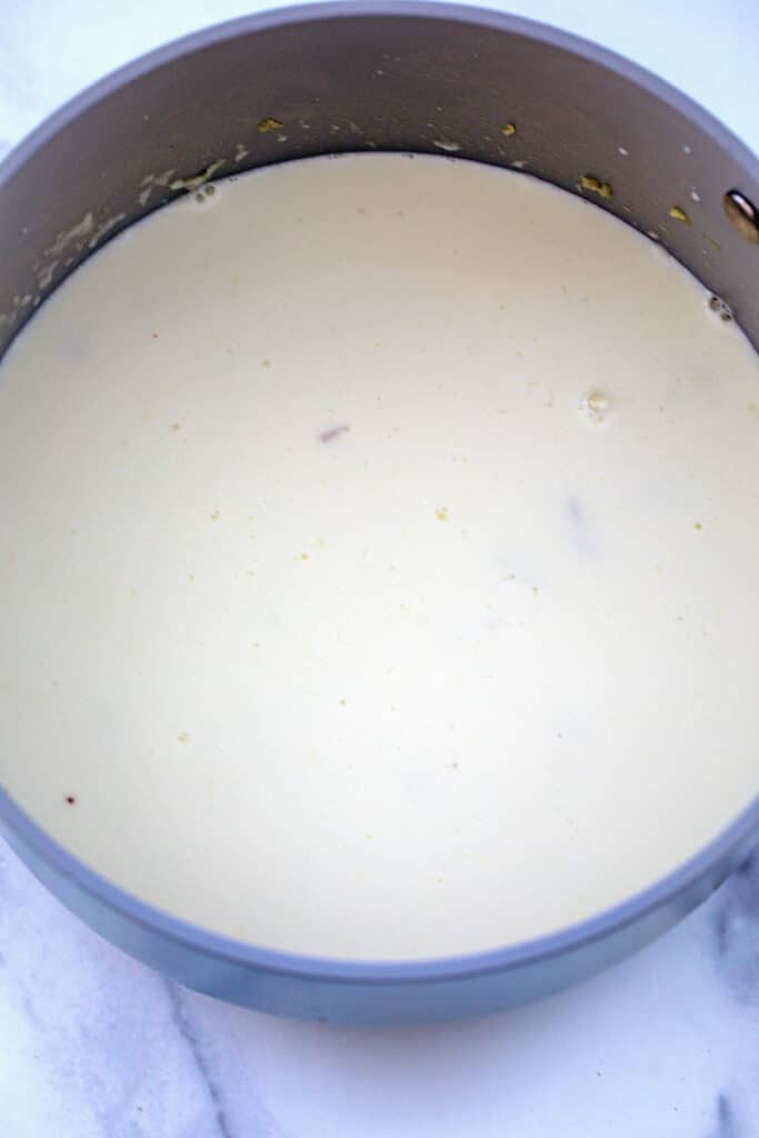 Milk an cream in saucepan with pineapple.