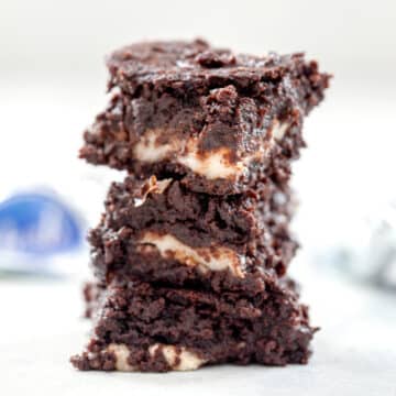 Closeup view of a stack of mint chocolate brownies.