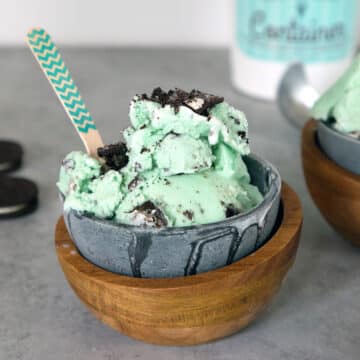 Head-on view of a bowl of light green mint oreo ice cream.