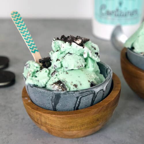 Head-on view of a bowl of light green mint oreo ice cream.