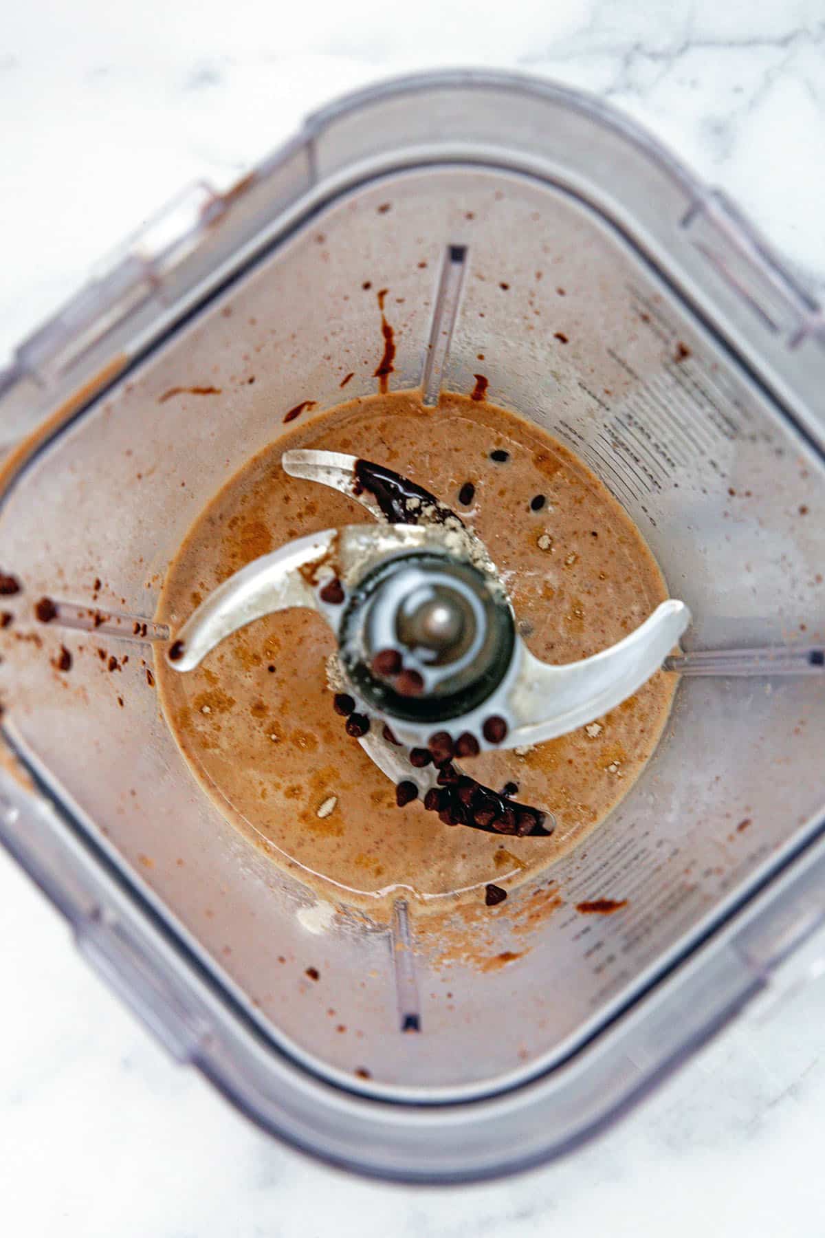 Overhead view of Frappuccino ingredients in blender.