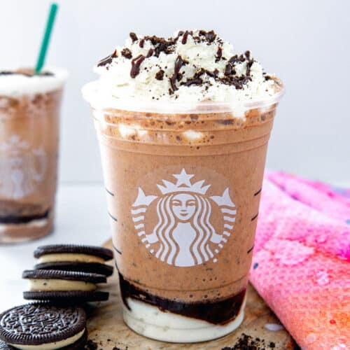 Closeup view of a Mocha Cookie Crumble Frappuccino with whipped cream and mocha sauce drizzle.