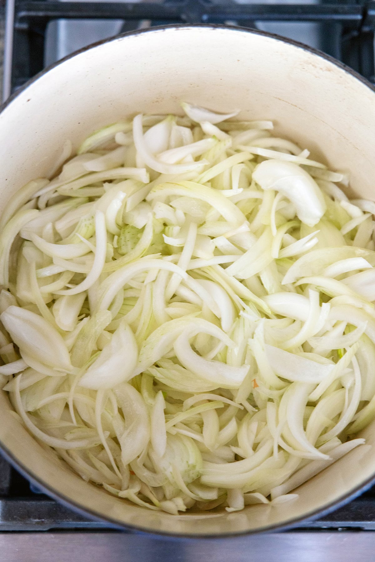 Sliced onions in a dutch oven.