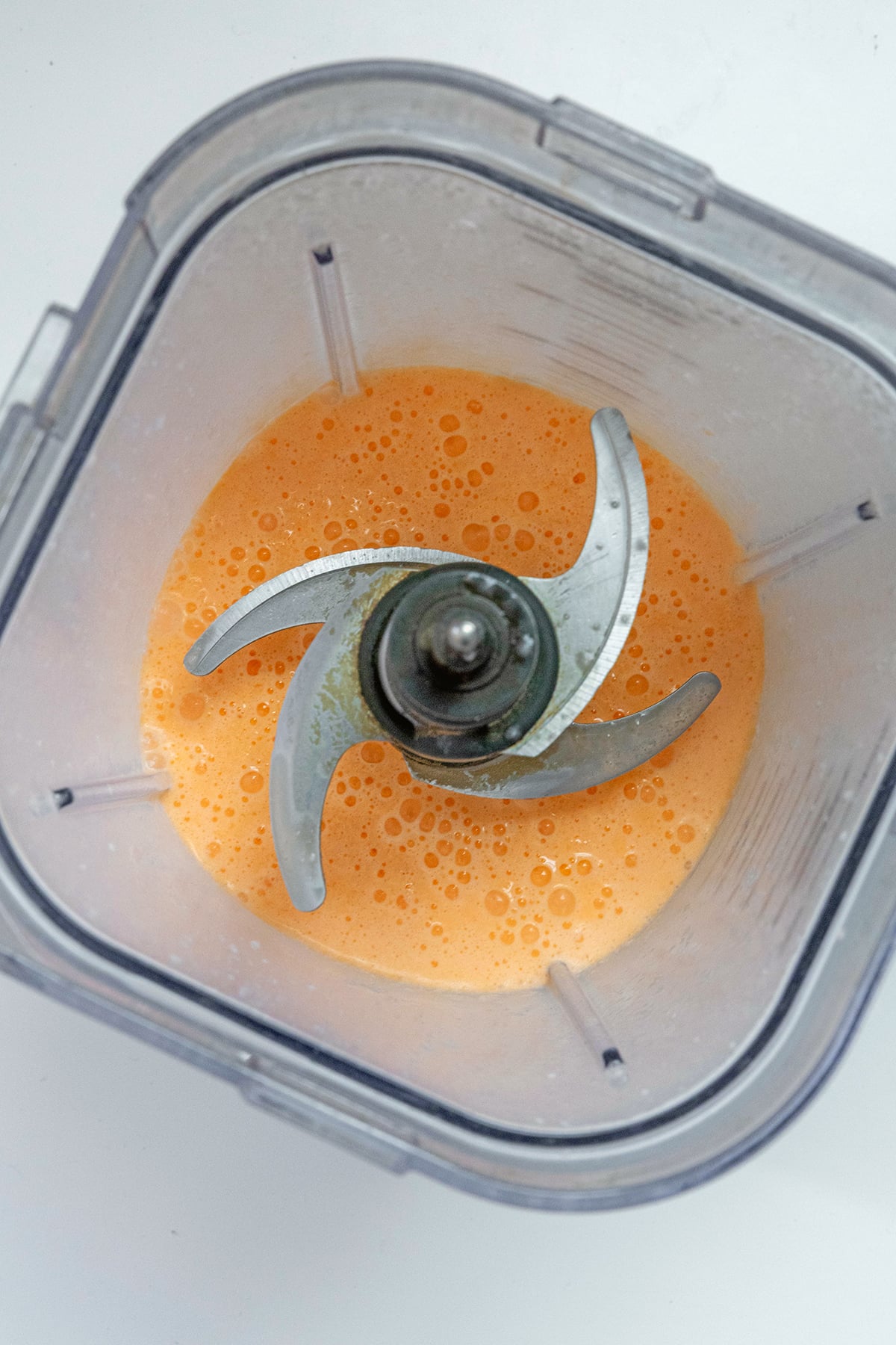 Overhead view of Orange Cream Frappuccino in blender all blended together.