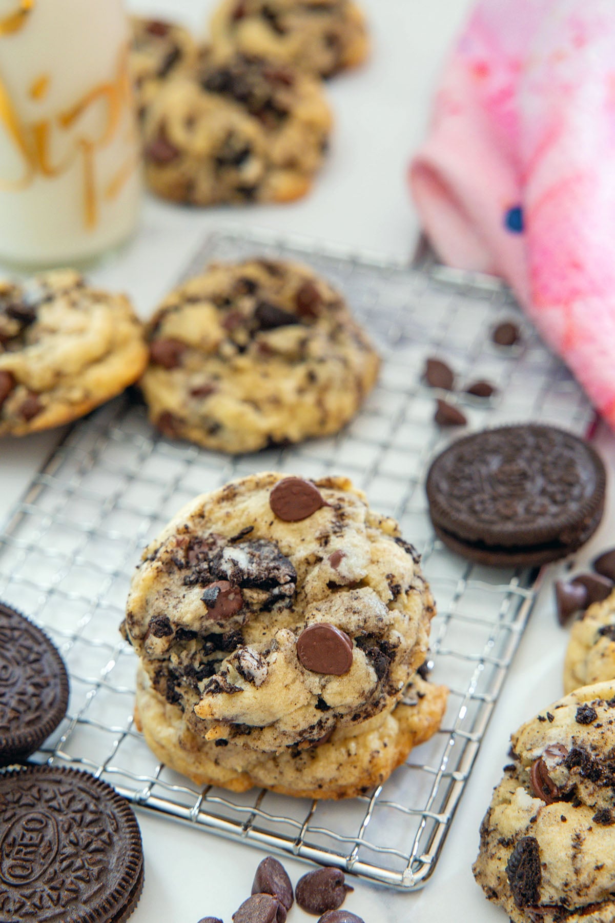 Overhead view of Oreo chocolate chip cookies all around with Oreo cookies and chocolate chips.