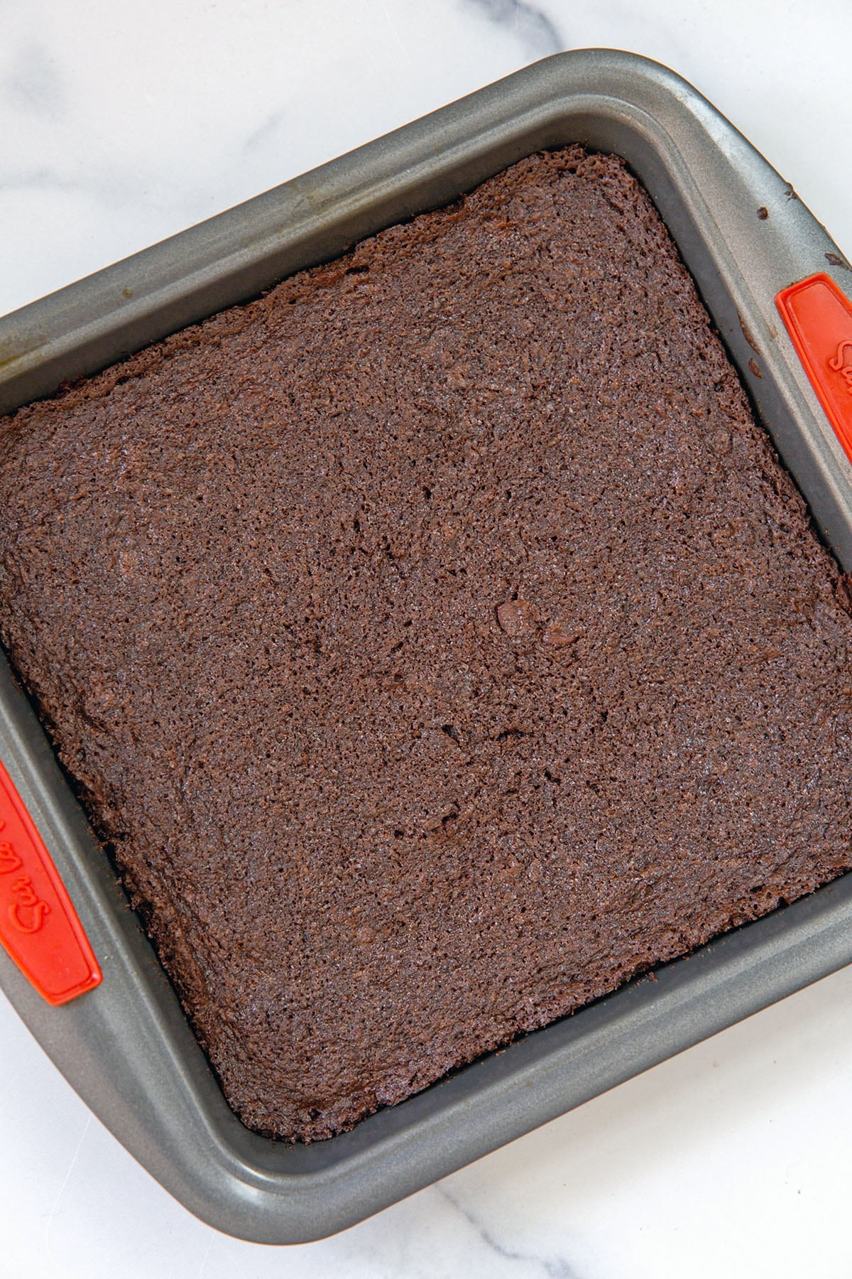 Overhead view of chocolate brownies baked in pan.