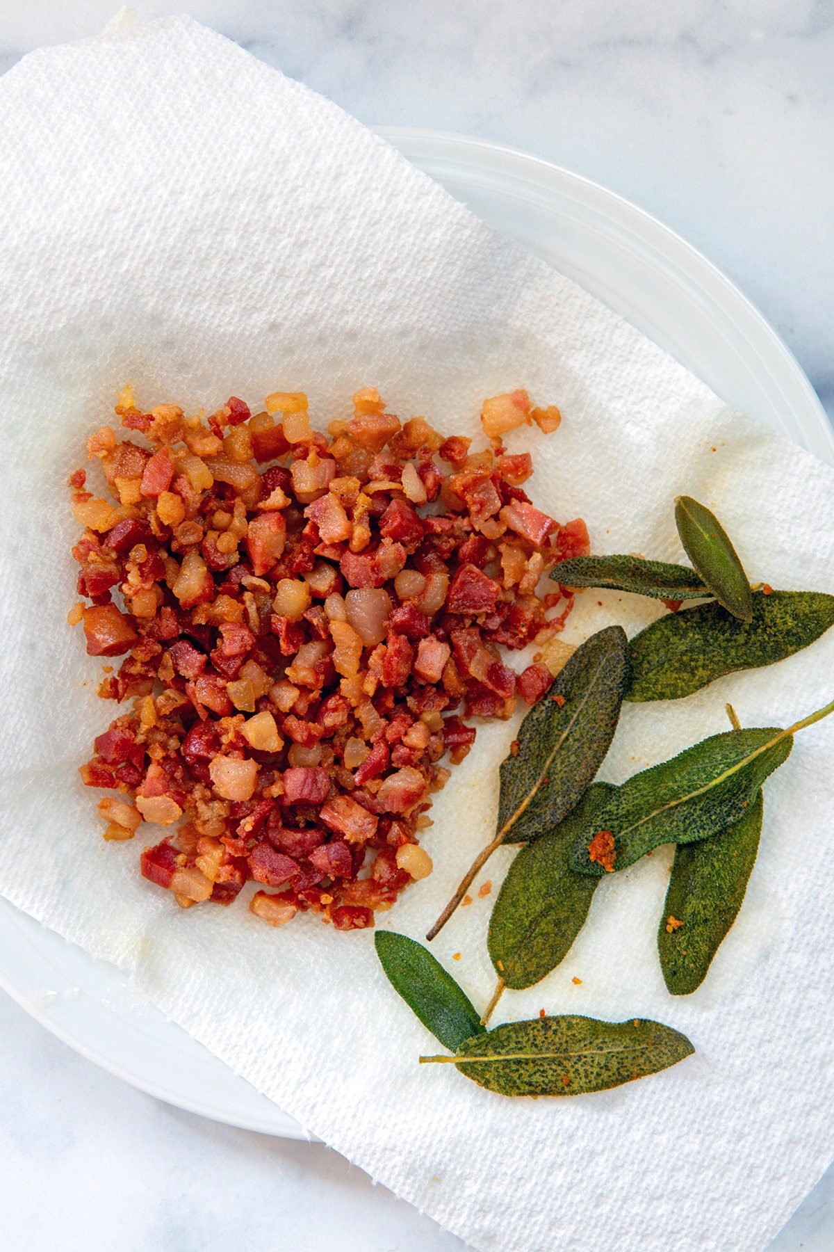 Pancetta and sage on a paper towel.