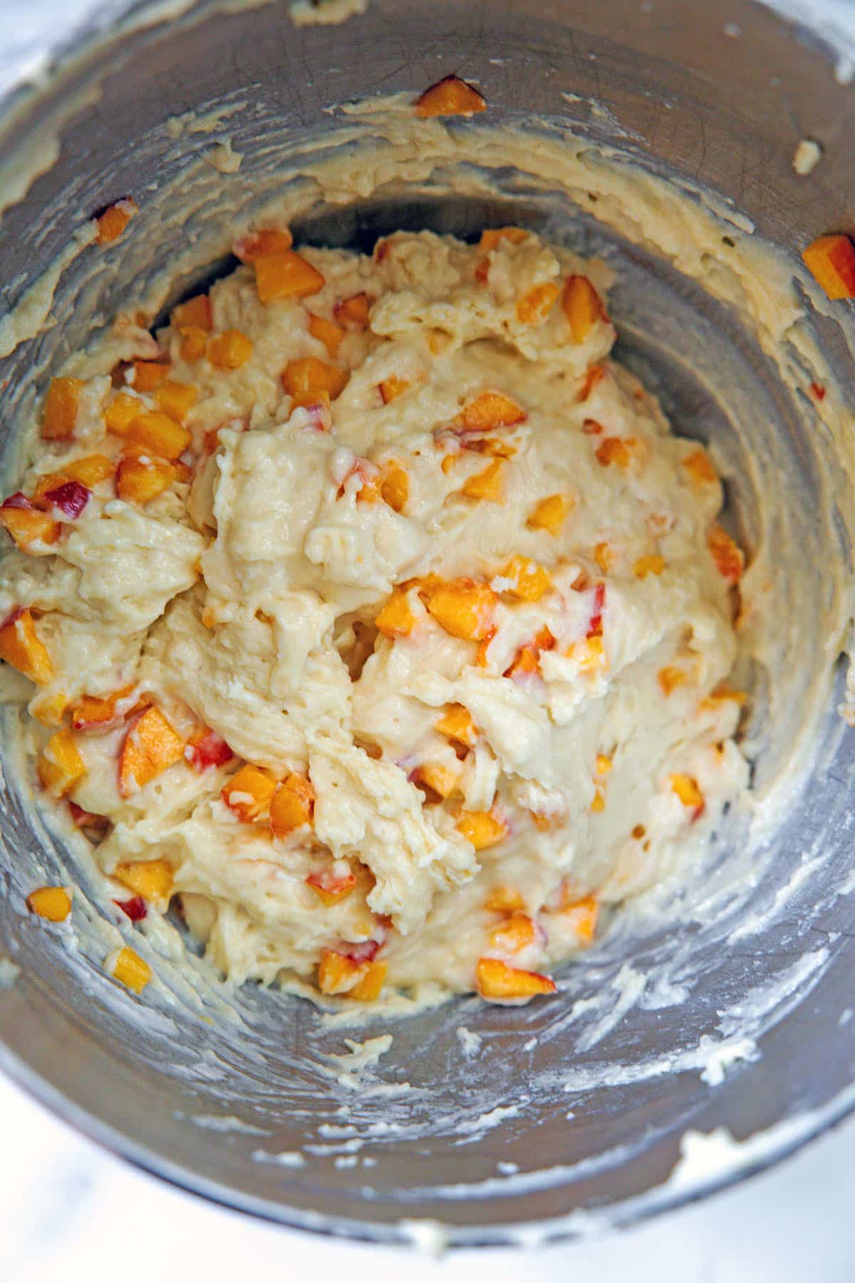 Peach cupcake batter in mixing bowl.