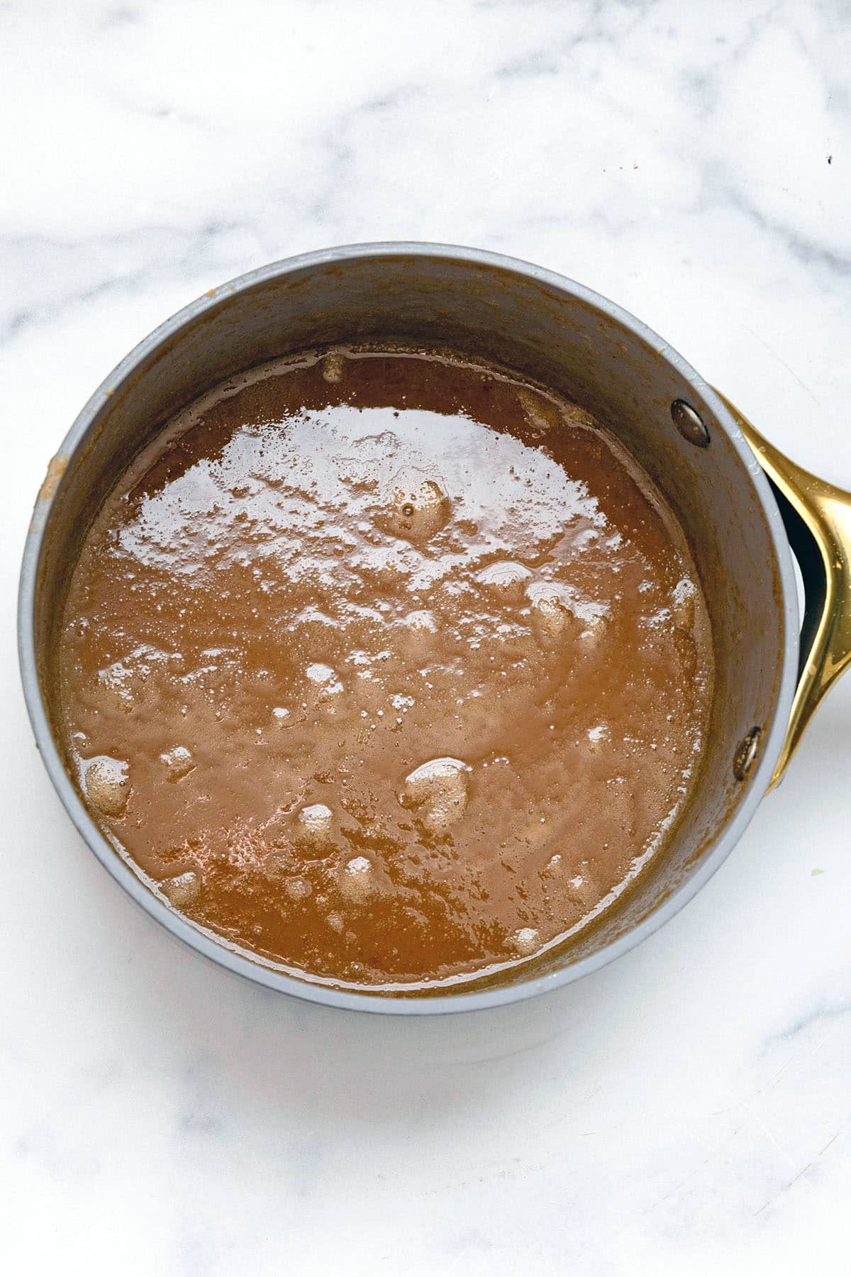 Peanut butter syrup in saucepan.