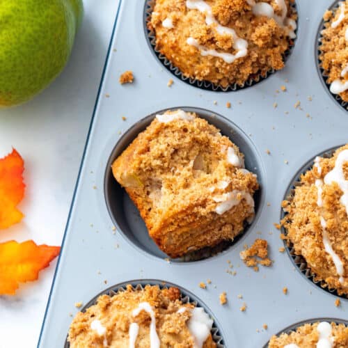 Close-up of pear muffins in a muffin tin.