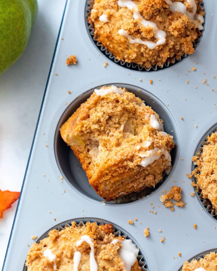 Close-up of pear muffins in a muffin tin.
