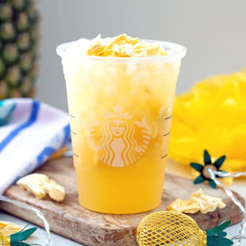 Head-on view of pineapple passionfruit refresher in Starbucks cup.