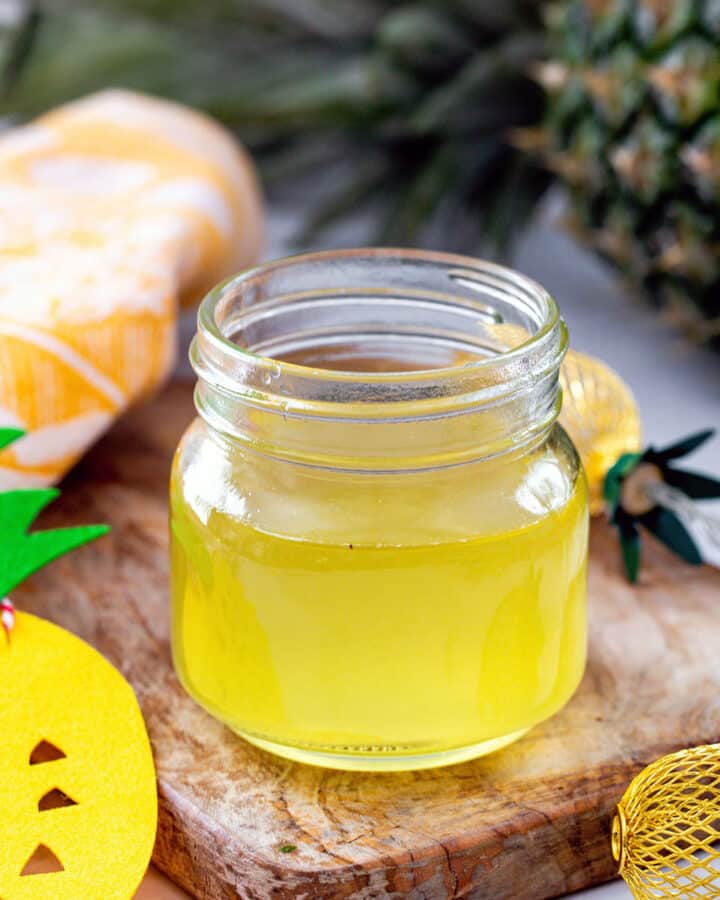 Small jar of pineapple syrup.